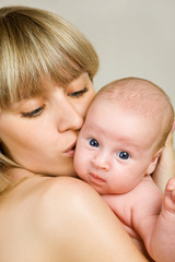 Happy mother with newborn baby