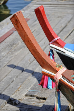 Prows of traditional long tail boats moored at Ko Panyi