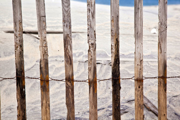 fence for protection of the dunes at the beautiful natural beach