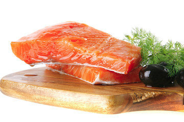 fresh smoked salmon on white plate with white cheese