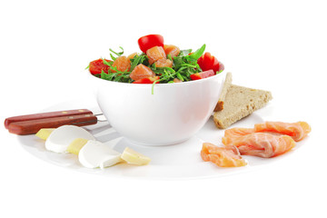 salad with smoked salmon in white bowl