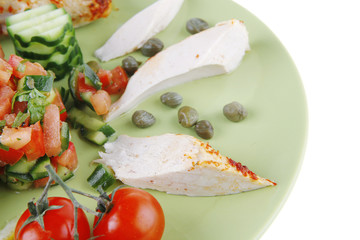 grilled chicken meat drumstick served green