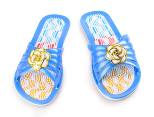 Pair of blue massage sandal on a white background