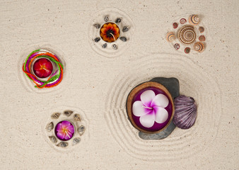 Candles with decoration on the sand background