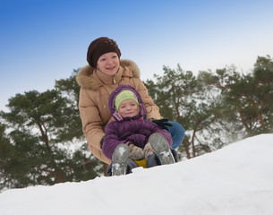 Fototapeta na wymiar Woman with little girl in winter