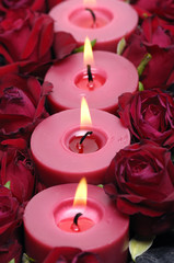 candlelight with rose on bamboo mat