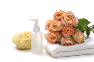 Fototapeta na wymiar spa accessory with pink rose on towel