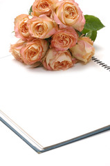 Bouquet of rose with notebook