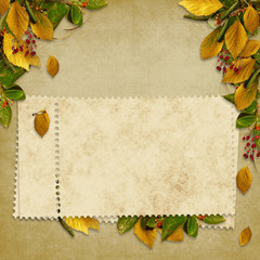 Card for the holiday  with autumn leaves on the abstract backgro