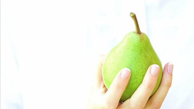 Pear in woman's hand