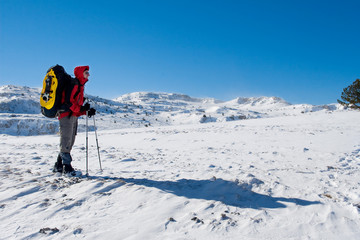 Hiker are in winter mountains