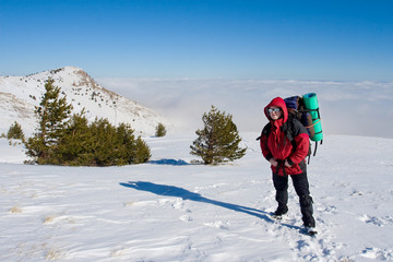 Fototapeta na wymiar Hiker are in winter mountains