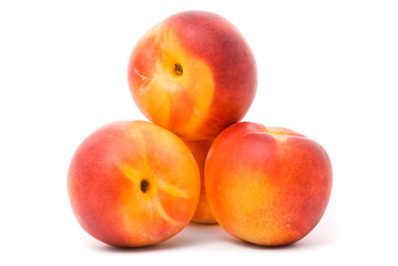 Juicy nectarines on a white background
