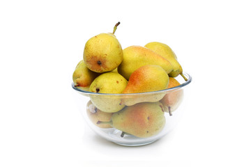 yellow pears on glass dish