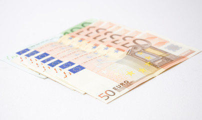 Euro bills on a white background
