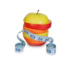 Slices of apples and orange as one fruit and a measuring ruler