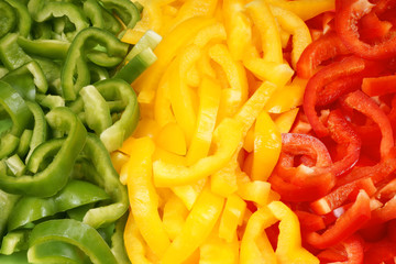 Slices of green, yellow and red bell pepper