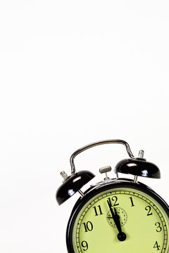 Black alarm clock isolated on corner text space above clock