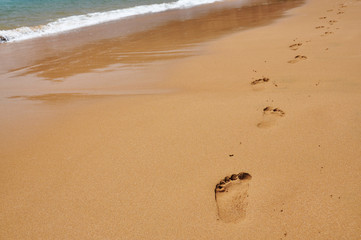 Footmarks on a sandy beach