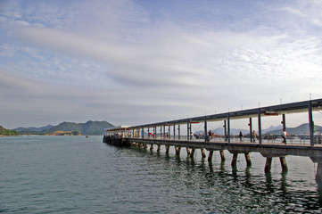 Marine pier with blue sk