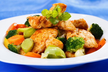 Roasted chicken meat with vegetable salad
