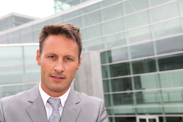 Portrait of businessman in grey suit