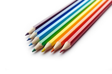 Colored pencils arranged in rainbow spectrum order