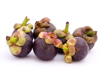 Ripe mangosteens on a white background