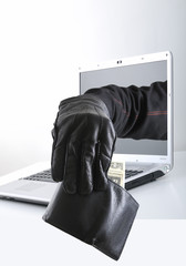 Hacker taking money out of pocket concet