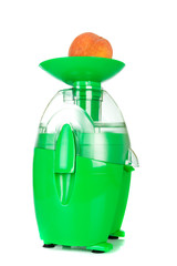 juicing machine with peach isolated on the white background