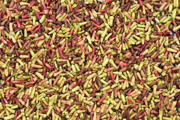 Green and red cloves for sale in market
