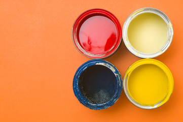 Colorful paints in tins
