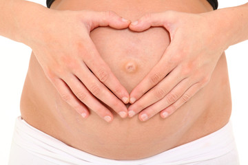 Pregnant Belly with Heart Shape Hands