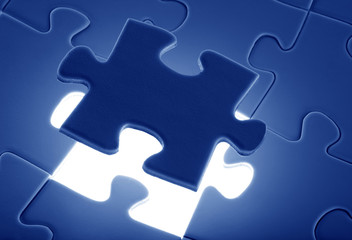 Fototapeta premium puzzle piece coming down into it's place