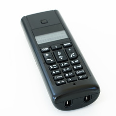 black telephone receiver with cord on white