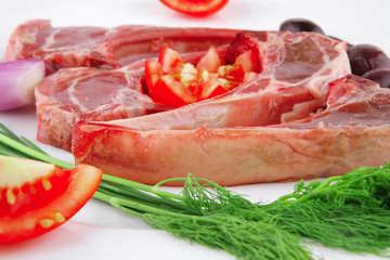 uncooked ribs on white