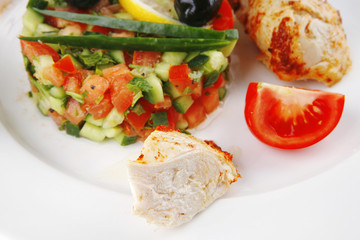 grilled chicken meat drumstick on white