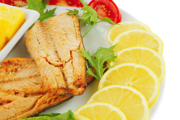 grilled salmon and lemon on white