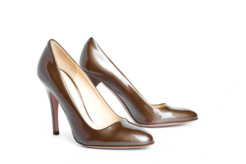 Beige-golden female new varnished shoes on high heel-stiletto