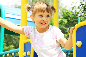A smiling girl on the playground
