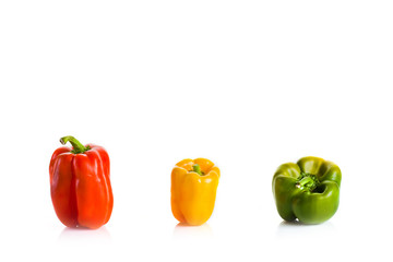 Red,yellow and green pepper isolated on white
