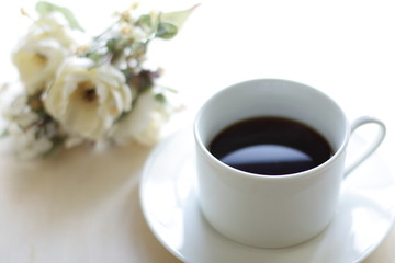 black coffee with flower