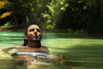 Relaxing man in water