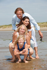 Fototapeta na wymiar Young family by the seaside