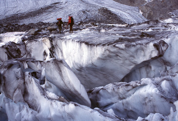 Alpinists and glacier slots, Alps