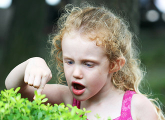 A Little Girl with Big Blue Eyes Makes a Discovery