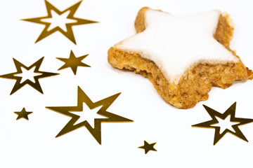 Zimtstern mit goldenen Sternen