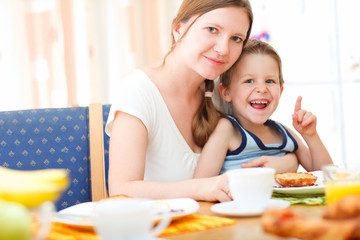 Mother and son having breakfast