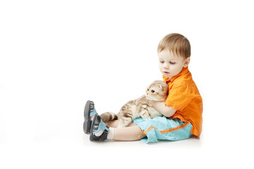 Little boy with a cat on a white background
