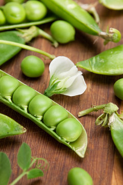 Green peas on wood board